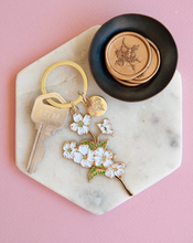 Load image into Gallery viewer, White Dogwoods Gold Enamel Keychain
